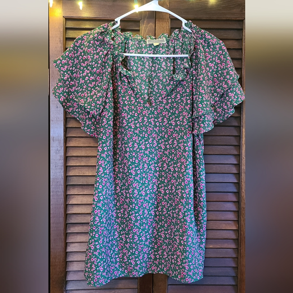 Pink and green floral shirt.